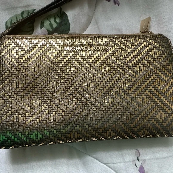 A golden Michael Kors “Adele” Smartphone Wristlet - Picture 6 of 6